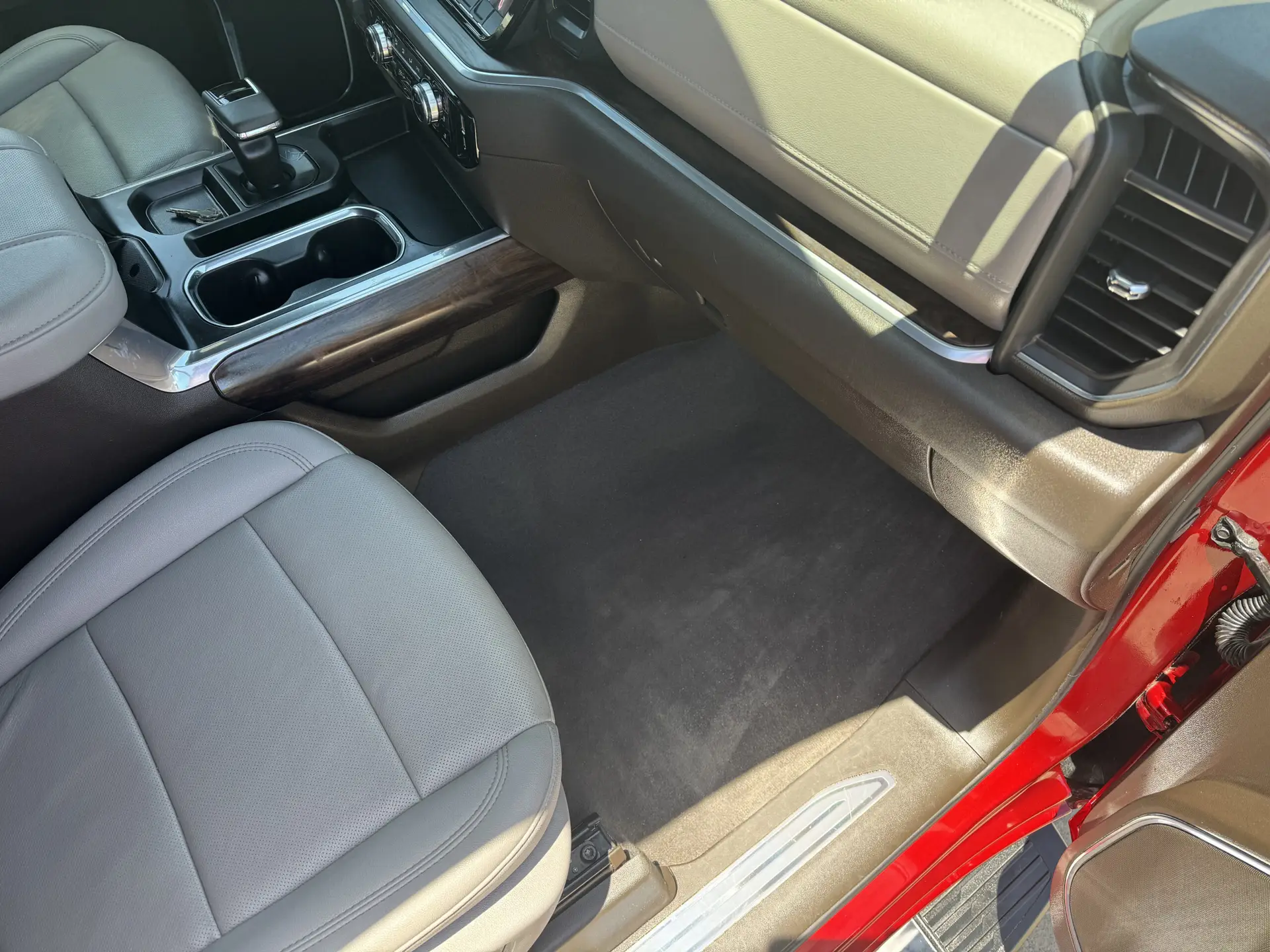 A freshly cleaned passenger side carpet, seat, and dash