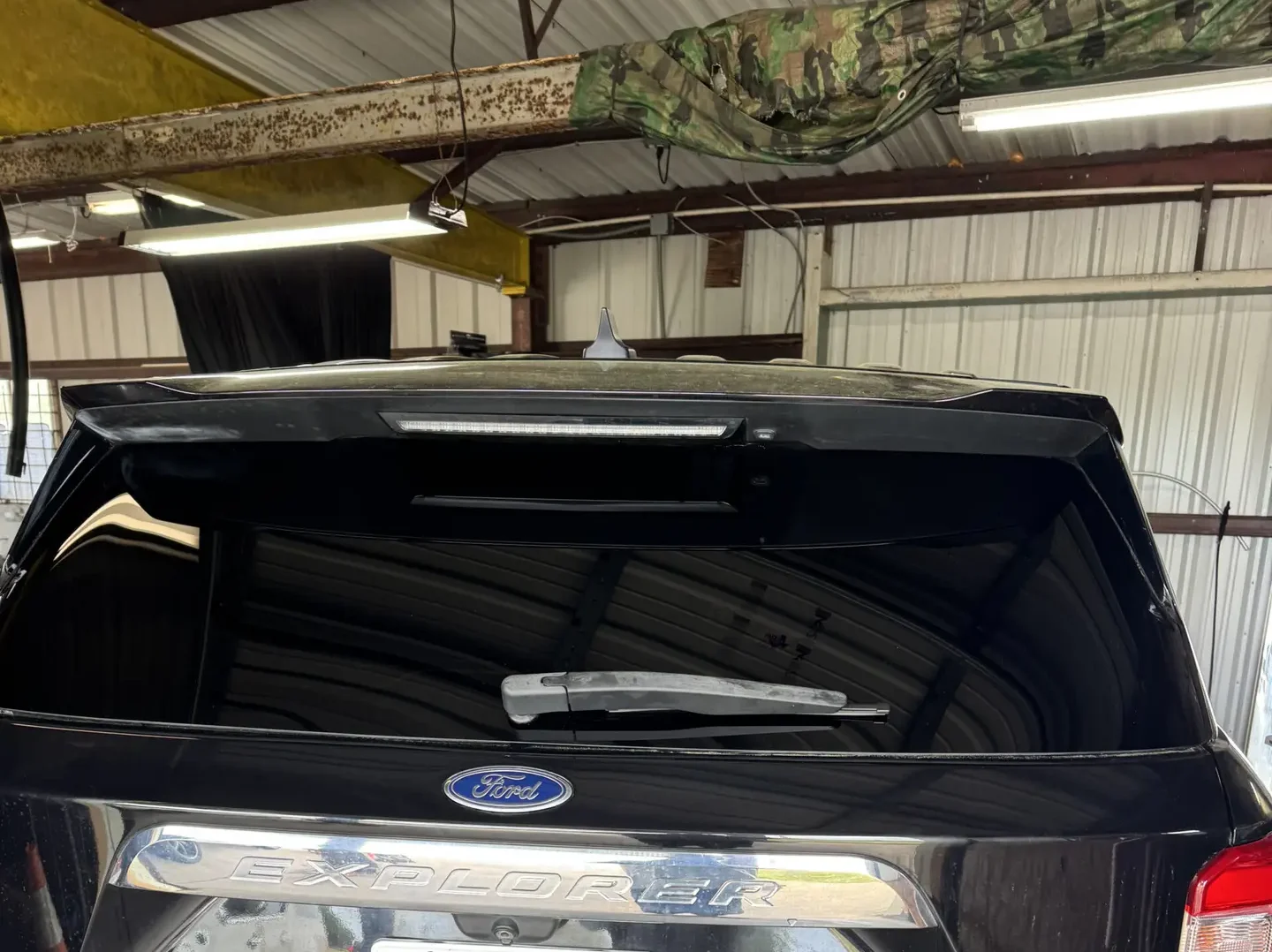 Freshly laid tint on a black Ford Explorer