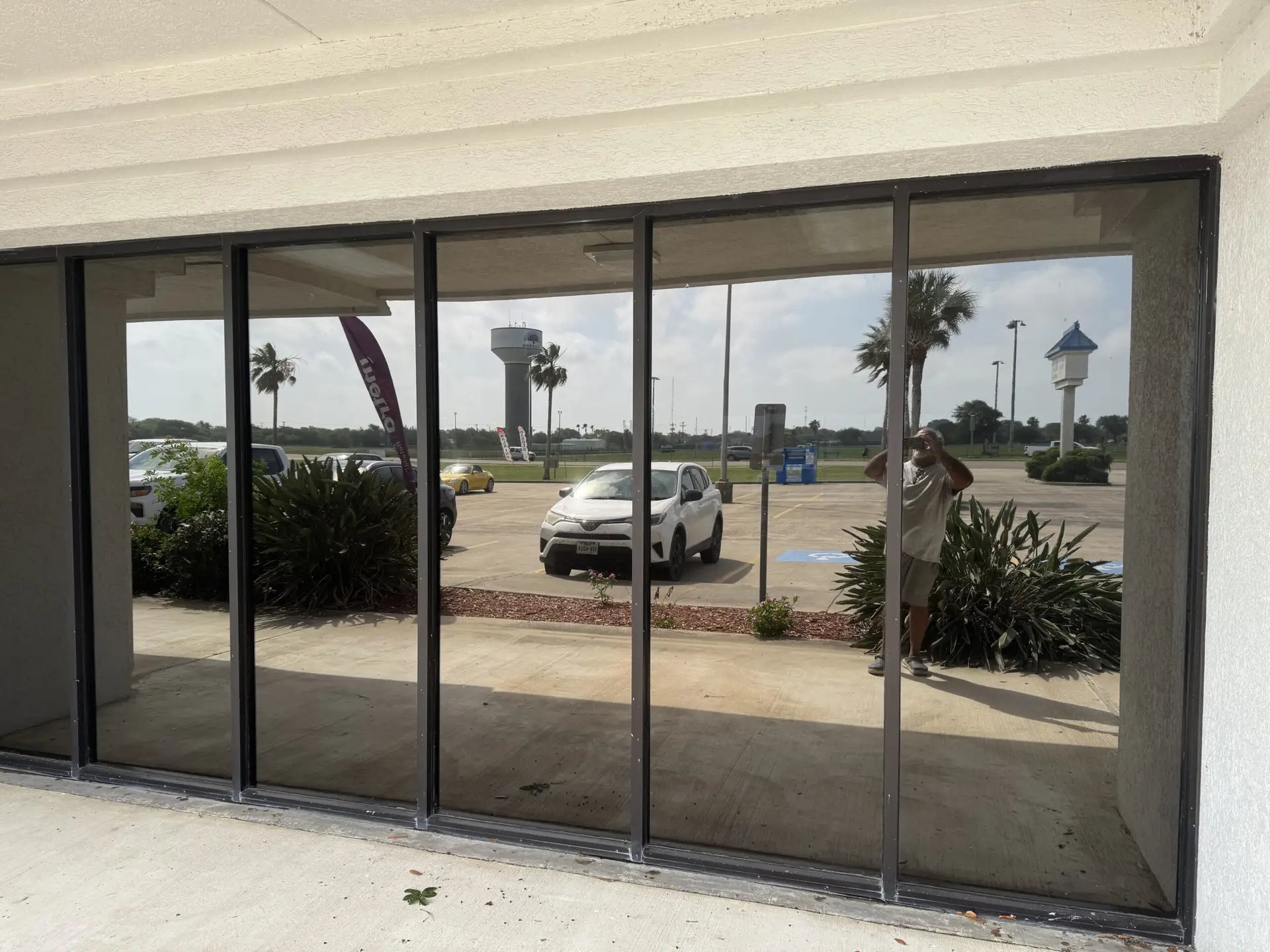 Exterior view of freshly tinted windows. The tint is a mirrored bronze color
